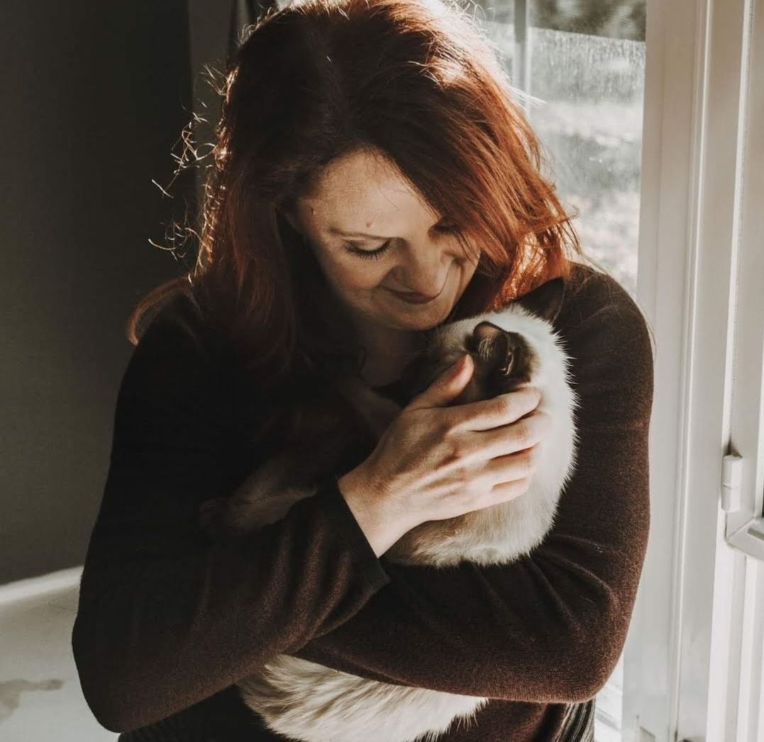 KJ snuggling a kitten