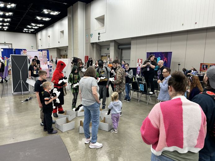 Kids and cosplayers playing Musical Cat Boxes at PurrCon
