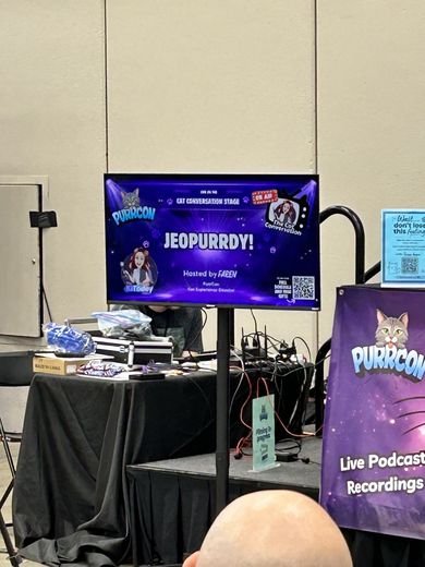 Jeopurrdy! trivia game on screen at The Cat Conversation stage