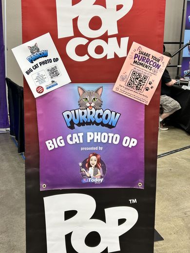 PurrCon Big Cat Photo Op sign inside PopCon Indianapolis