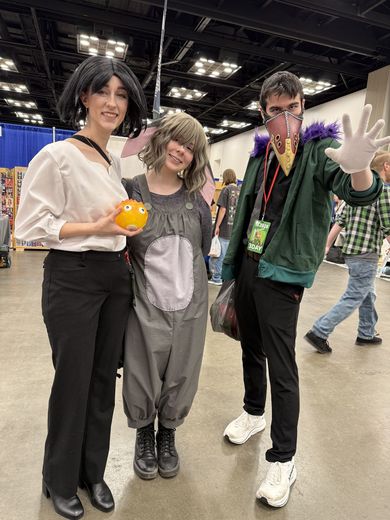 Cosplayers posing together on the PurrCon convention floor