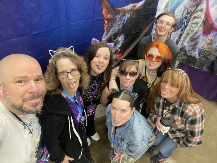 Group of friends in cat ears taking a selfie at PurrCon