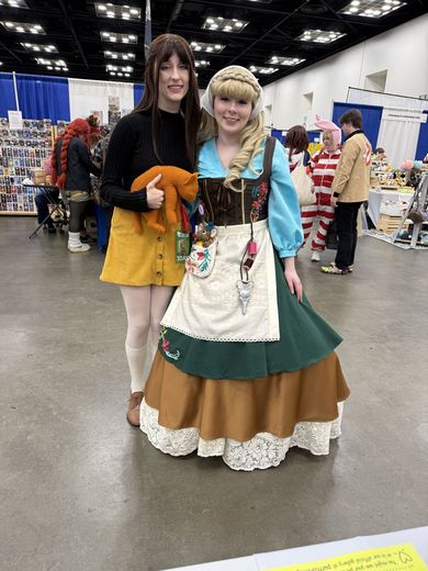 Two cosplayers in storybook costumes at PurrCon