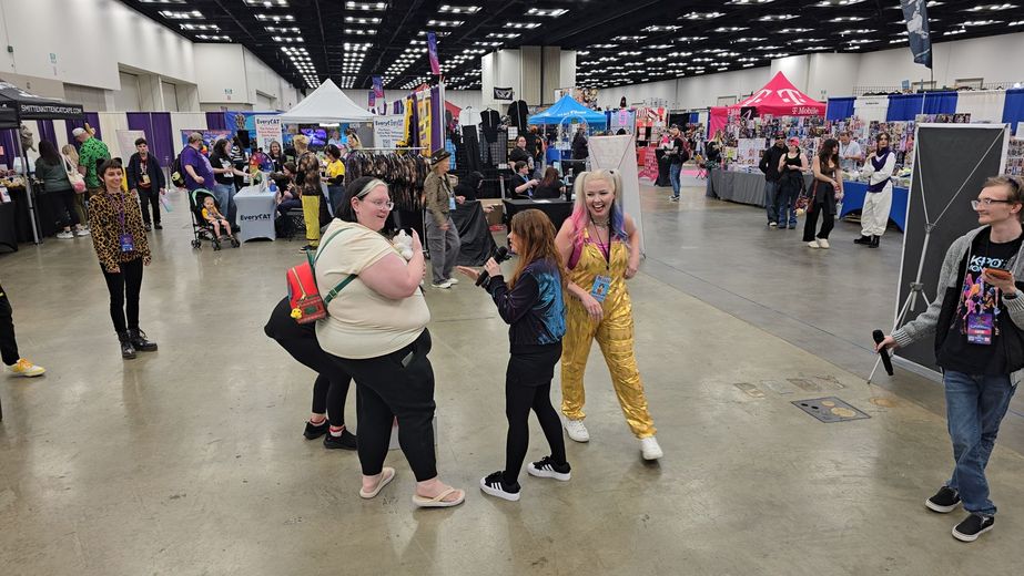 Crowds walking the PurrCon convention floor inside PopCon
