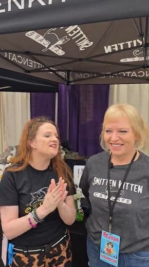 Two women chatting at the Smitten Kitten Cat Cafe booth