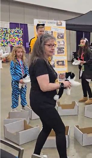 Attendee dancing during Musical Cat Boxes